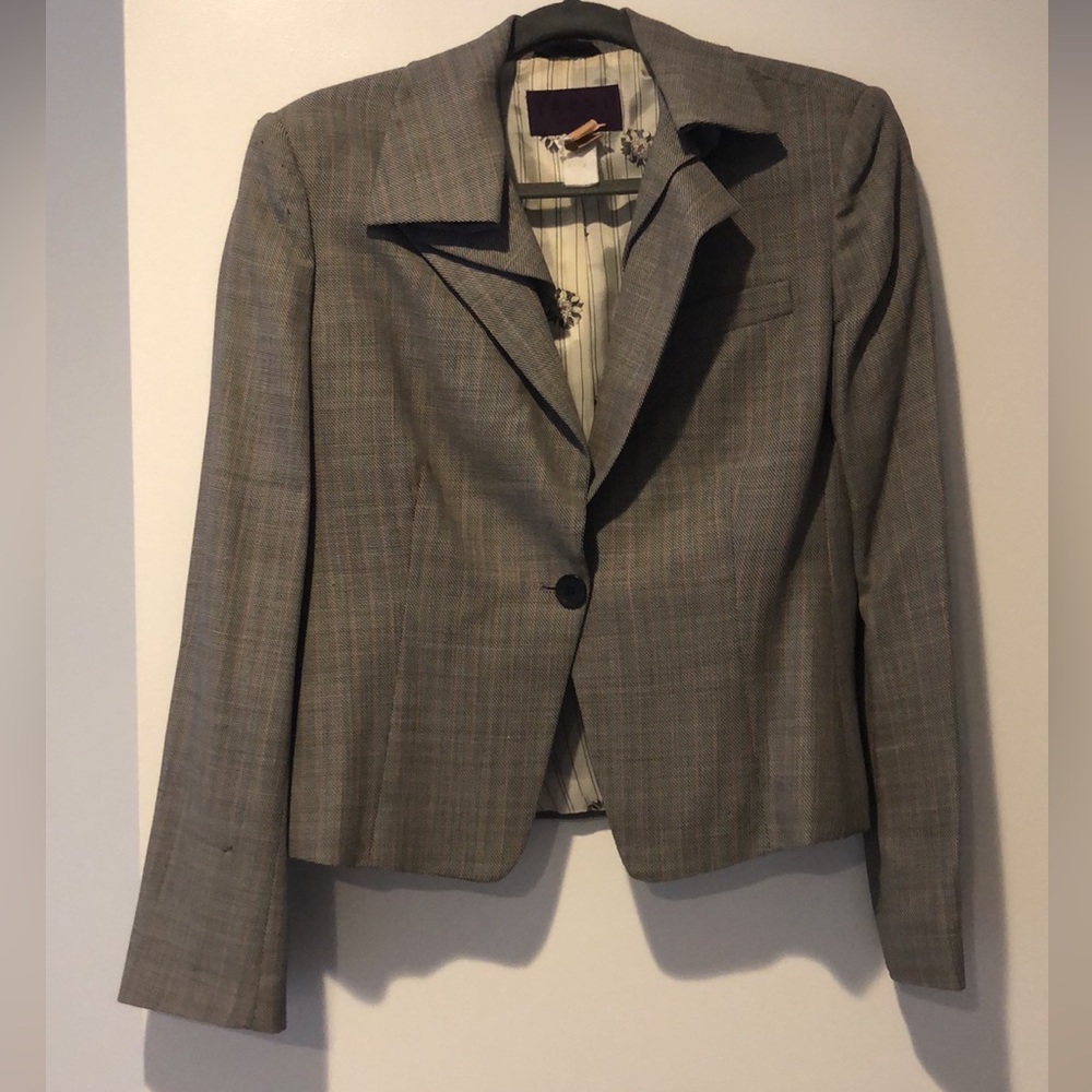 Uniquely styled designer jacket and skirt suit.